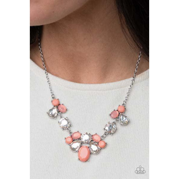 Paparazzi Ethereal Romance – Orange Necklace & Earrings Set  Varying in opacity and shape, mismatched Burnt Coral beads attach to oversized white rhinestones, creating bubbly frames that delicately link into an ethereal display below the collar. Features an adjustable clasp closure.