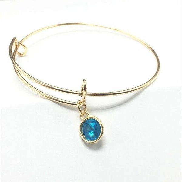 Gold Wire Bracelet with Lake Blue Charm
