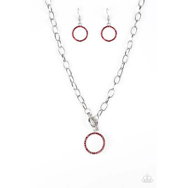 Paparazzi All In Favor - Red Necklace & Earrings Set  Encrusted in fiery red rhinestones, a bubbly silver pendant swings below the collar for a colorfully casual look. Features a toggle closure.