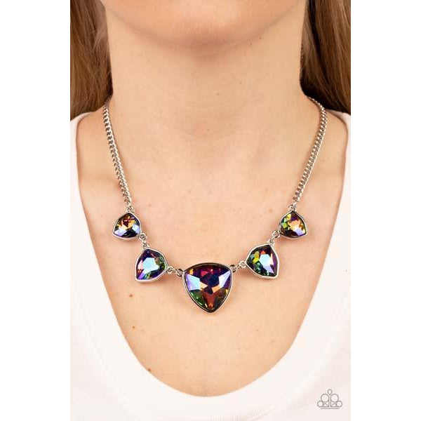 Paparazzi Cosmic Constellations - Multi Necklace & Earrings Set   Encased in sleek silver fittings, an oversized collection of UV geometric gems gradually increase in size as they link below the collar for a stellar statement. Features an adjustable clasp closure. Due to its prismatic palette, color may vary.