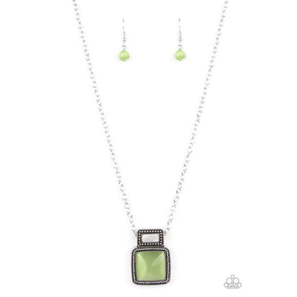 Paparazzi Ethereally Elemental - Green Necklace & Earrings Set  A shell-like accent is pressed into the center of a studded silver frame that sits atop a silver rope-like frame that is dotted with a square Green Ash cat's eye stone. The colorful pendant swings from a shiny silver chain, creating an ethereal pendant below the collar. Features an adjustable clasp closure.