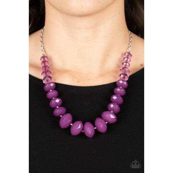 Paparazzi Happy-GLOW-Lucky Purple Necklace & Earrings Set  Separated by dainty silver beads, glassy Poinciana crystal-like beads gradually morph into opaque Poinciana crystal-like beads below the collar. The vibrant compilation grows in size and intensity further below the collar, adding dramatic dimension to the colorful centerpiece. Features an adjustable clasp closure.