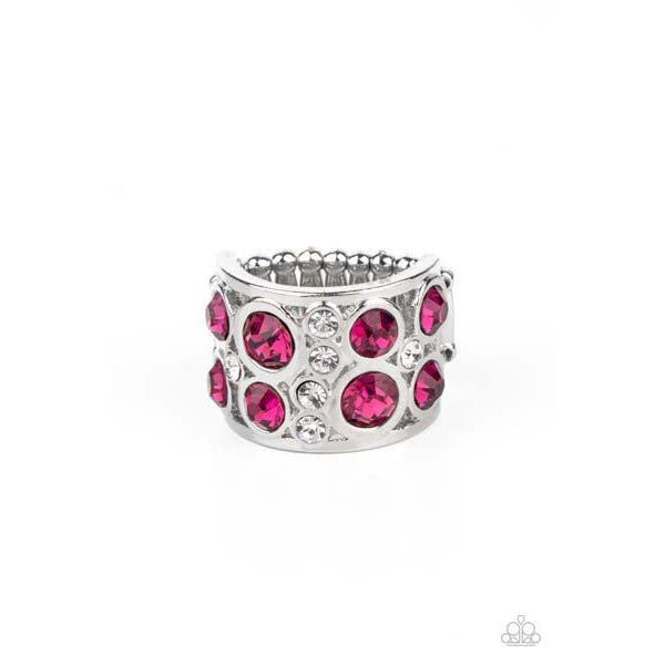 Paparazzi High Roller Royale - Pink Stretch Ring  Sporadic sections of dainty white rhinestones and oversized pink rhinestones haphazardly coalesce inside an airy silver frame, creating a dramatically dazzling centerpiece around the finger. Features a stretchy band for a flexible fit.  Sold as one individual ring.