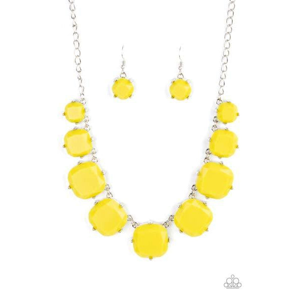 Paparazzi Prismatic Prima Donna – Yellow Necklace & Earrings Set  Encased in pronged silver fittings, faceted Illuminating beads gradually increase in size as they link below the collar, creating a flamboyant pop of color. Features an adjustable clasp closure.