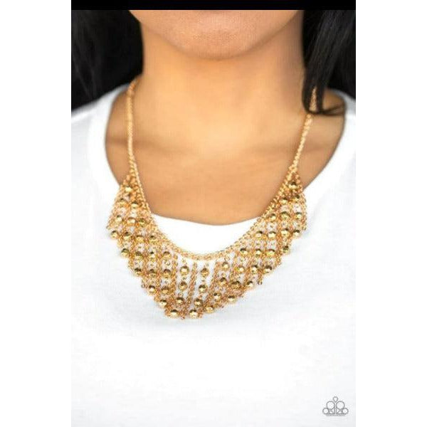 Paparazzi Rebel Remix Gold Necklace & Earrings Set  Stands of faceted gold beads and glistening gold chains stream from a matching gold chain, creating an edgy fringe below the collar. Features an adjustable clasp closure.