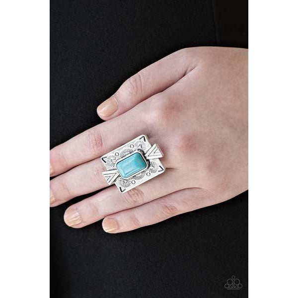 Paparazzi Stone Cold Couture - Blue Stretch Ring  Chiseled into a tranquil rectangle, a refreshing turquoise stone is pressed into a bold silver frame radiating with tribal-inspired patterns for a seasonal look. Features a stretchy band for a flexible fit.
