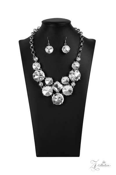 Zi Collection "Unpredictable" Necklace & Earrings Set  Varying in size and shape, a dramatic collision of oversized white rhinestones connect into an unapologetically glamorous statement piece below the collar. Attached to chunky silver links, the breathtaking display of clustered gems radiates confidence. Features an adjustable clasp closure.